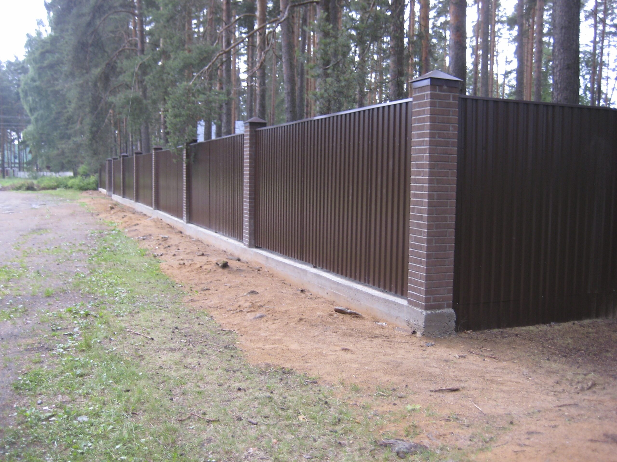 Custom dark Colorbond fence installation Capalaba