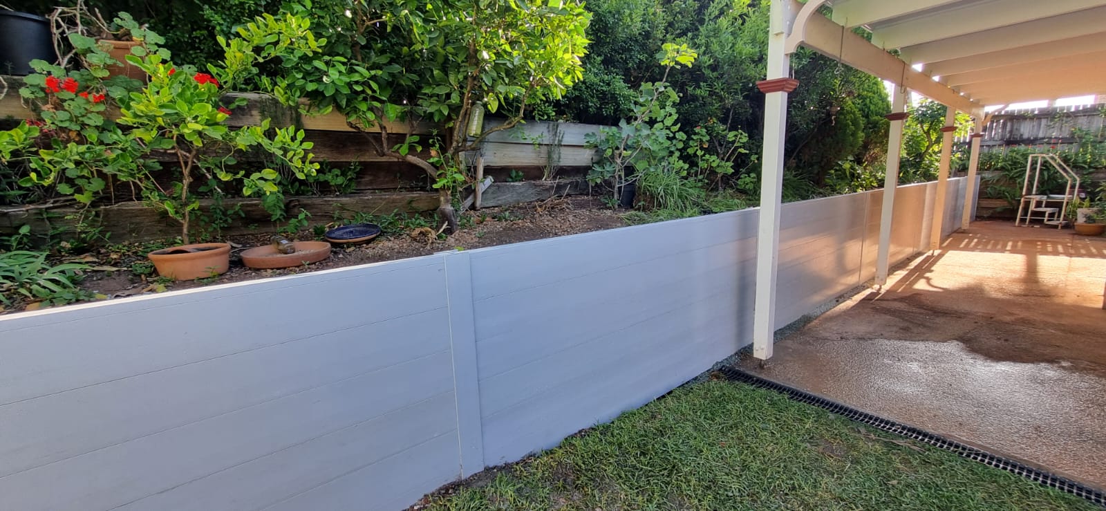 Complete backyard makeover with retaining wall by Tropical Scapes Capalaba