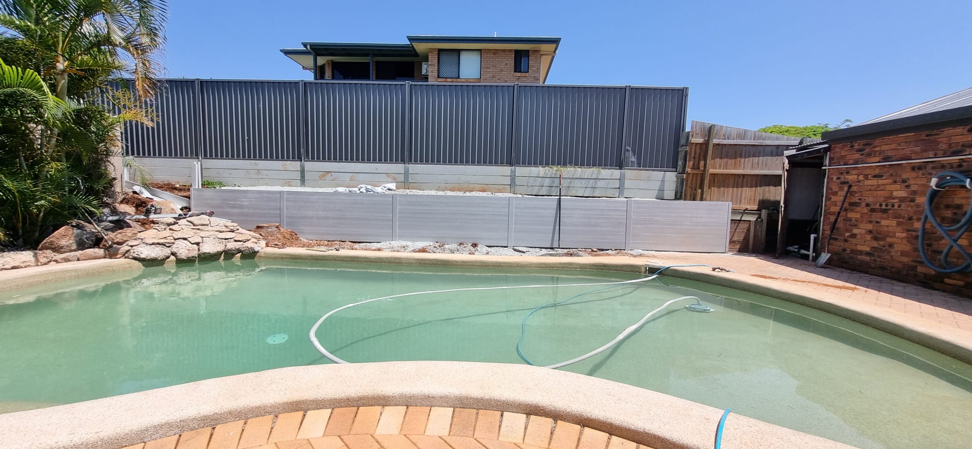 Timber paling boundary fence construction in Capalaba